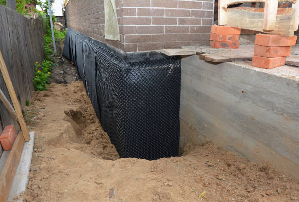 SJ Waterproofing Pros technician performing targeted Waterproofing assessment in Elmwood Park, IL